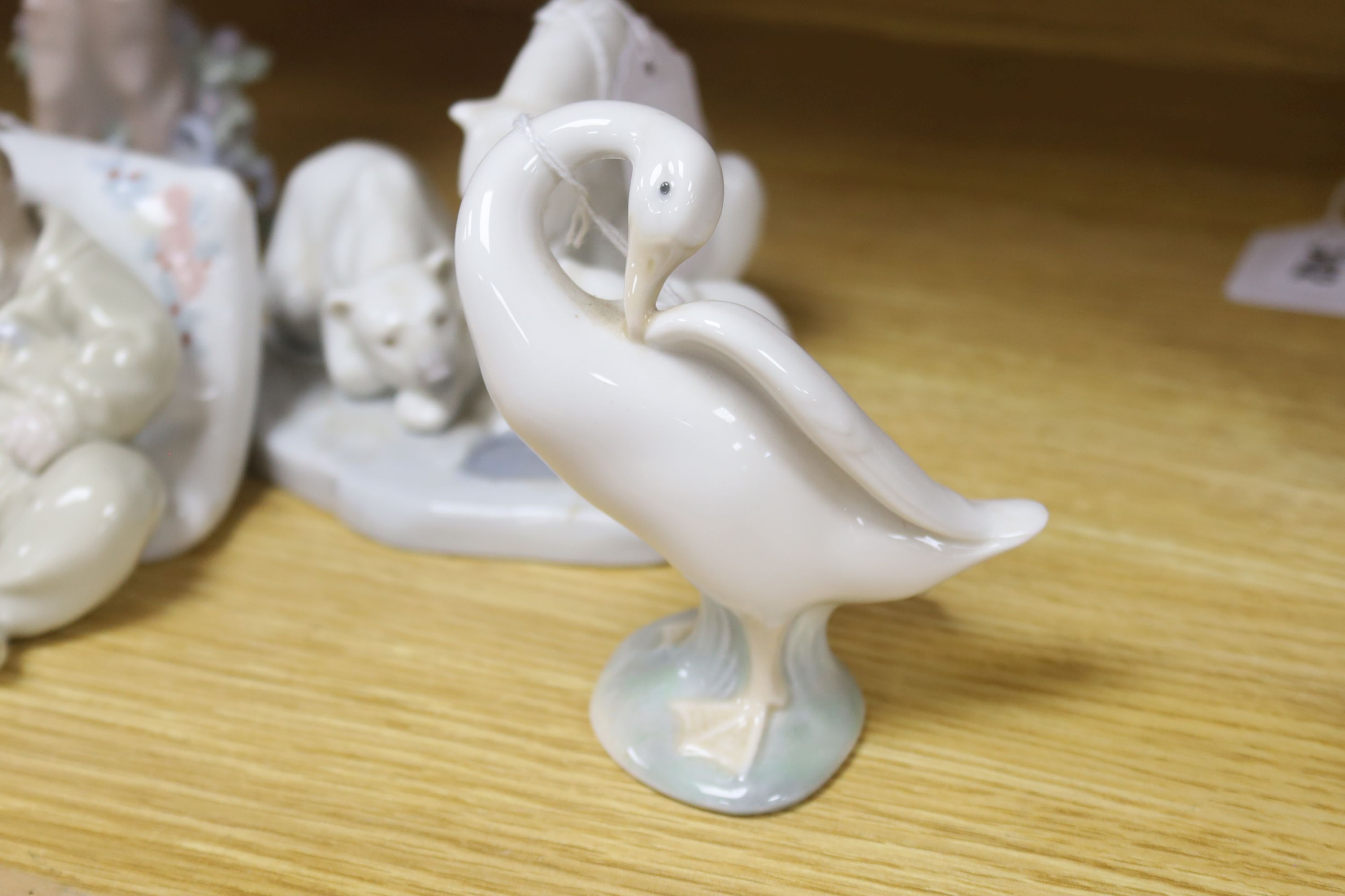 Five Lladro figures, comprising 'An Elegant Touch', 'Spring', 'Little Dreamers', 'Bearly Love' and a goose